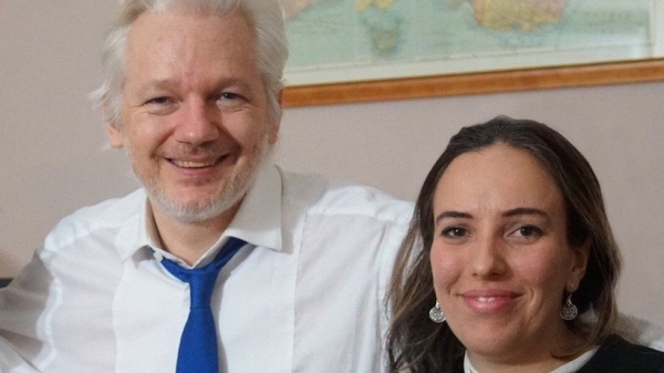 Julian Assange and his partner Stella Moris. /BBC