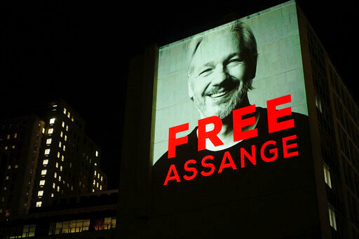 An image of Julian Assange is projected onto a building in Leake Street in central London on Sunday, April 10, 2022. /AP=Yonhap