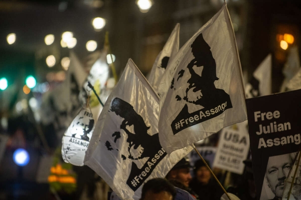 Protesters march in support of Julian Assange on February 11, 2023, in London, England. / Truthout